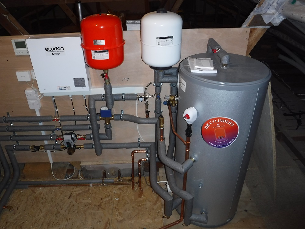 Hot water cylinder for heat pump installed within warm loft, AECB Retrofit Standard bungalow in Wrexham