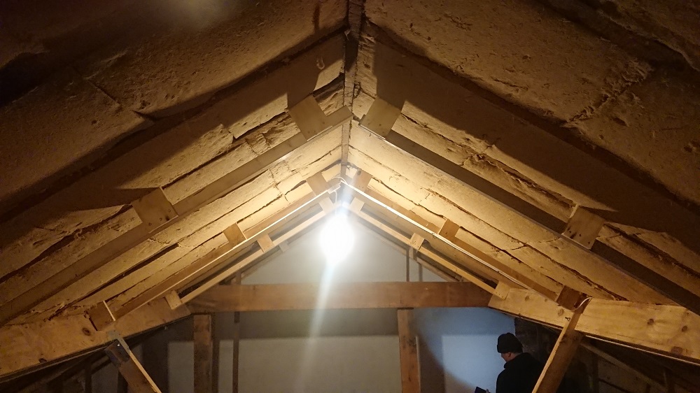 Flexible wood fibre between rafters, with rafter extensions showing that will hold more underneath